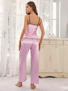 Detail of pink and white vertical striped satin pajama set showing smooth silk texture