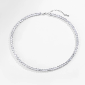 Detailed macro view of square cut cubic zirconia tennis necklace with silver claw setting
