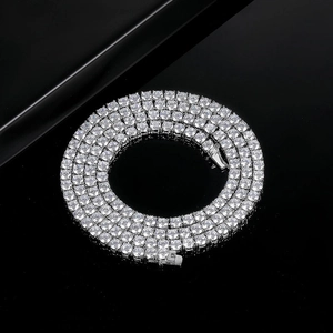 Sparkling 18K white gold plated tennis necklace with round-cut cubic zirconia on black background