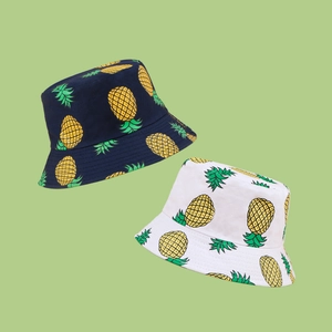 Unisex pineapple print wide brim bucket hats in navy blue and white cotton fabric