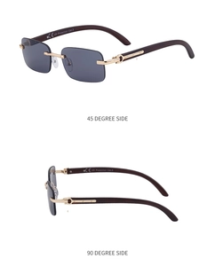 Detail view of rimless sunglasses with gold frame, wood grain temples and CE mark