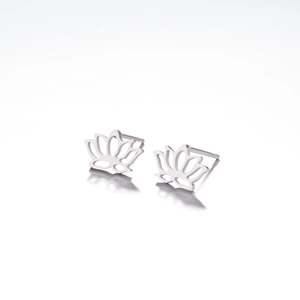 Detail showing silver hollow lotus petal earrings with polished metallic finish and reflections