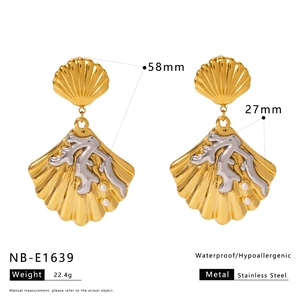 Detailed dimensions of shell earrings featuring gold coral and pearl on white backdrop