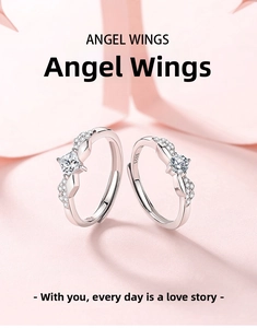 Close-up of S925 sterling silver angel wings couple rings with sparkling zircon stones