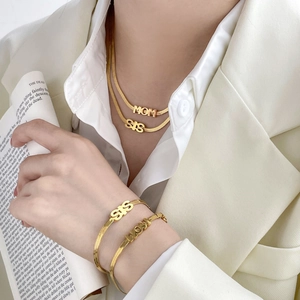 Golden MOM and SIS snake chain jewelry set worn with elegant white professional attire