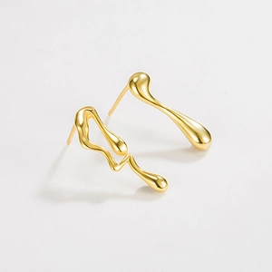 Asymmetric gold fluid metal stud earrings with modern minimalist organic drop design