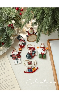 Set of 6 resin Christmas ornaments featuring Santa and Snowman in a cozy festive setting