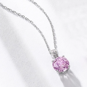 Elegant S925 silver necklace featuring a large pink round-cut gemstone with diamond accents