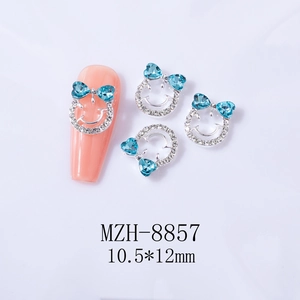 Breloque nail art nœud avec strass cœur bleus et base argentée, taille 10,5x12mm