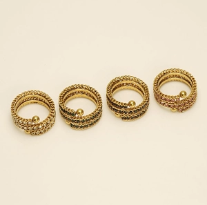 Detail of 18k gold plated multi-layer chain rings with colorful zircon stones set in gold