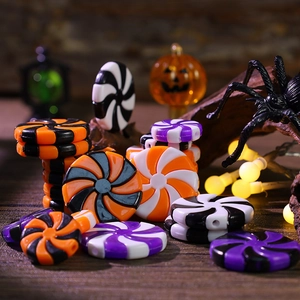 Halloween candy spiral beads in orange, black, and purple for DIY craft decoration