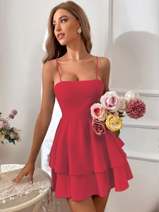 Detail of red tiered mini dress with square neckline and delicate spaghetti straps