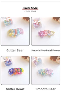 Close-up of glitter bear and floral elastic hair ties in vibrant pastel colors