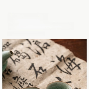 Macro detail of Ru kiln tea cup showing celadon glaze ice-crackle texture and hand-painted art