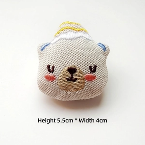 Close-up of a plush bear head with embroidery, measuring 5.5cm tall for DIY crafts