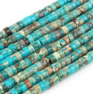 Macro detail of flat round blue imperial jasper spacer beads for DIY jewelry making