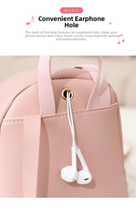 Detail of pink PU leather backpack showing a metal earphone port with white wired headphones