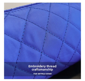 Macro shot of blue quilted nylon texture and precise diamond stitching on a handbag