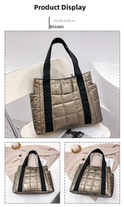 Detail view of the metallic brown quilted down tote bag with side pocket and woven strap