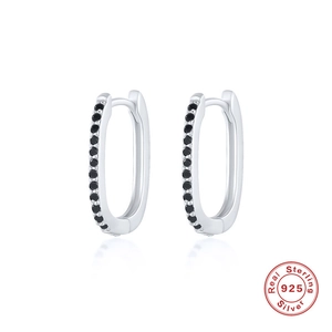 Detailed macro view of S925 sterling silver oval earrings featuring black cubic zirconia stones
