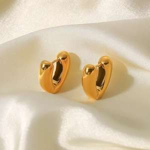 Chic 18K gold plated heart shaped stainless steel hoop earrings on white silk