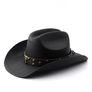 Black straw cowboy hat featuring a faux leather band with a golden bull head emblem