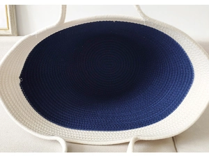 Detailed interior view of large cotton rope woven beach bag with navy and white stitching