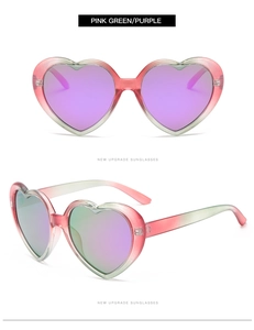 Detail of pink and green gradient heart-shaped sunglasses with purple polarized lenses