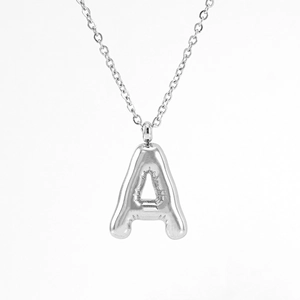 Detail of silver bubble letter A pendant with glossy metallic finish and balloon design