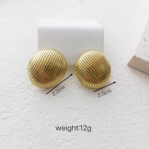 Detailed view of 18K gold-plated geometric stud earrings with vertical texture