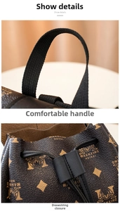 Detail view of the black webbing handle and leather drawstring on brown printed backpack