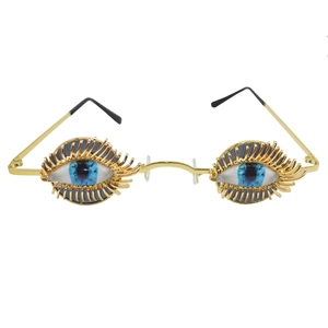 Vintage gold oversized eye-shaped sunglasses with blue eyeballs and long metal lashes