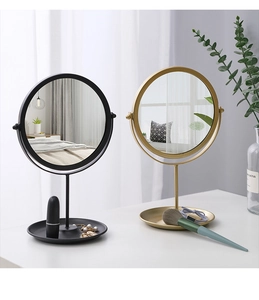 Round metal vanity mirrors in black and gold finish with integrated storage base trays