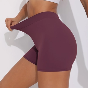 Close-up of high-waist plum yoga shorts showing elastic fabric and seamless design