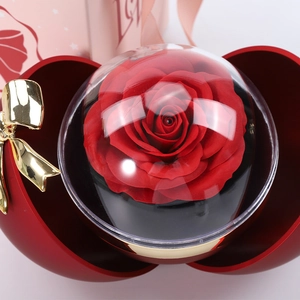Preserved red rose gift box with golden bow and spherical magnetic closure for jewelry