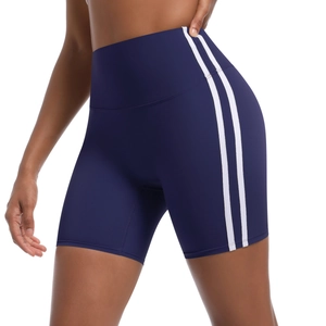 Detail of high-waist navy yoga shorts with dual side stripes and compression fabric