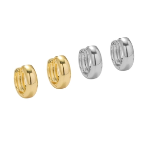 Minimalist wide hoop earrings in gold and silver finishes shown from a side perspective