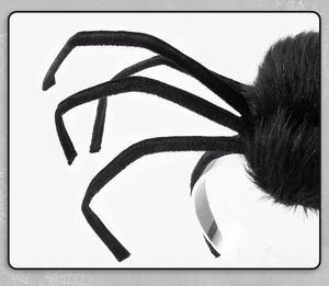 Close-up of fuzzy black plush spider headband with adjustable legs for Halloween party