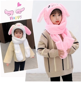 Detail of plush bunny ear hat with integrated scarf and gloves in pink and white