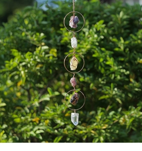 Detailed view of natural amethyst suncatcher with metal rings and colorful raw crystals
