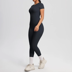 Detail of black slim-fit yoga set showing double-sided brushed fabric and side stitching
