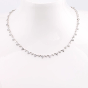 Detail of S925 sterling silver clavicle chain with shimmering triangle diamond pendants