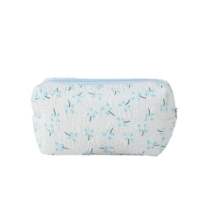 Floral fabric pencil case with light blue flower patterns and quilted texture design