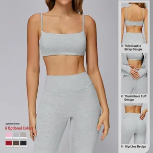 Heather grey two-piece yoga set with strappy tank top, thumb holes and high waist leggings