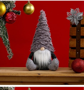 Close-up of a Nordic Christmas gnome with long white beard and gray pointed plush hat