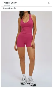 Front view of women's yoga set with deep V-neck crop top and high waist shorts in magenta