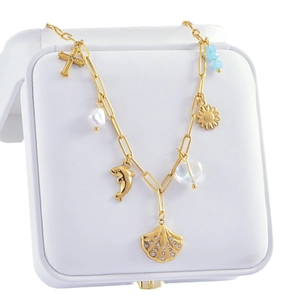 Marine style titanium steel necklace with shell, dolphin and pearl charms on a white box