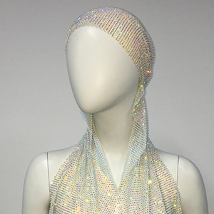 Detailed macro view of sparkling AB rhinestones on the elastic mesh turban party headpiece