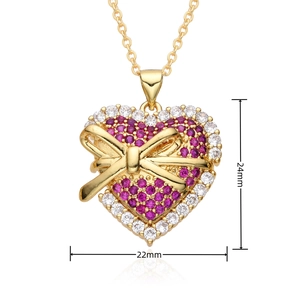 Detail view of heart pendant with bow and purple zircons, measuring 24mm by 22mm