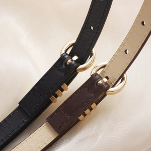 Fashionable slim leather belts for dresses in black and brown with golden metal buckles
